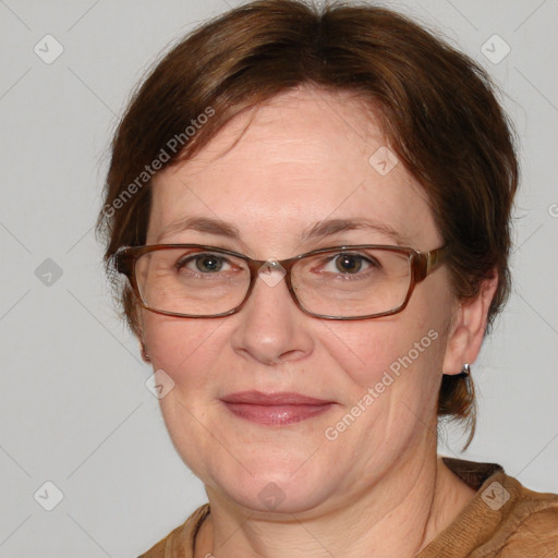 Joyful white adult female with medium  brown hair and blue eyes