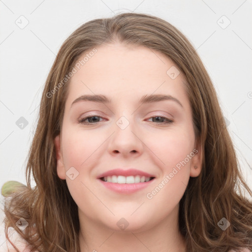 Joyful white young-adult female with long  brown hair and blue eyes