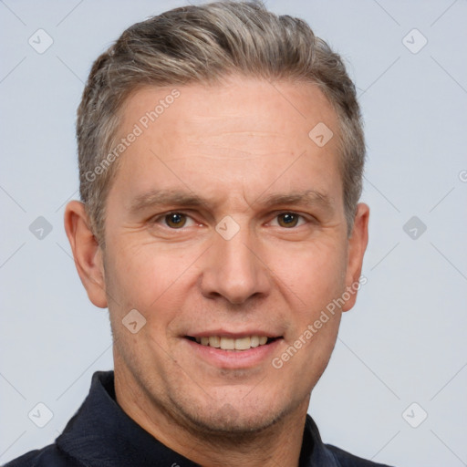 Joyful white adult male with short  brown hair and brown eyes