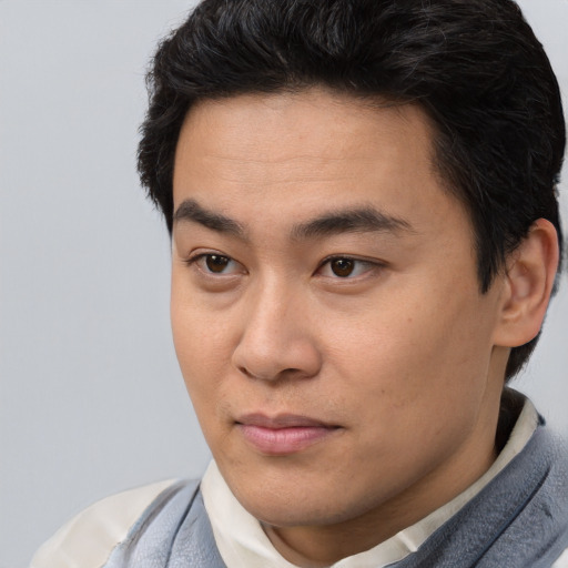 Neutral latino young-adult male with short  brown hair and brown eyes