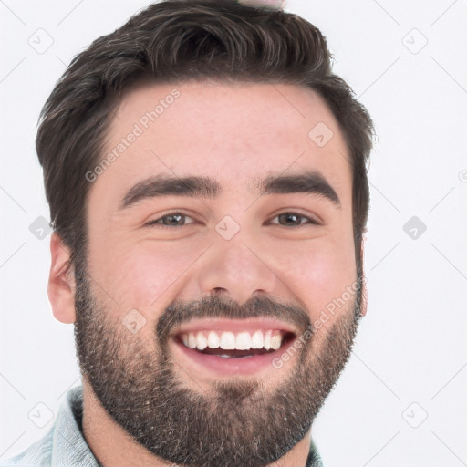 Joyful white young-adult male with short  black hair and brown eyes