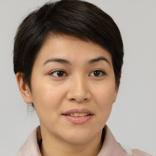 Joyful asian young-adult female with medium  brown hair and brown eyes