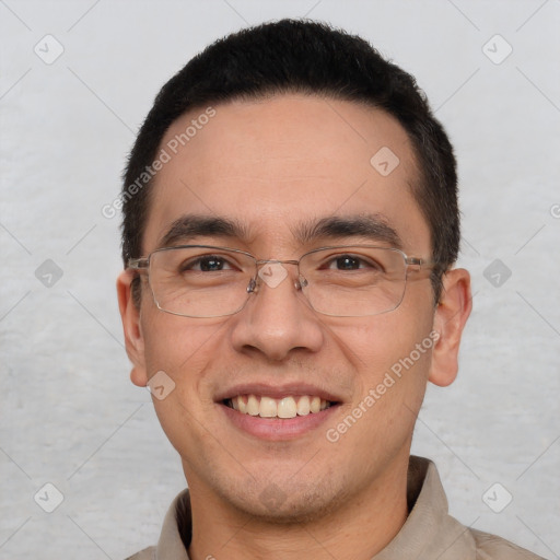 Joyful white adult male with short  black hair and brown eyes