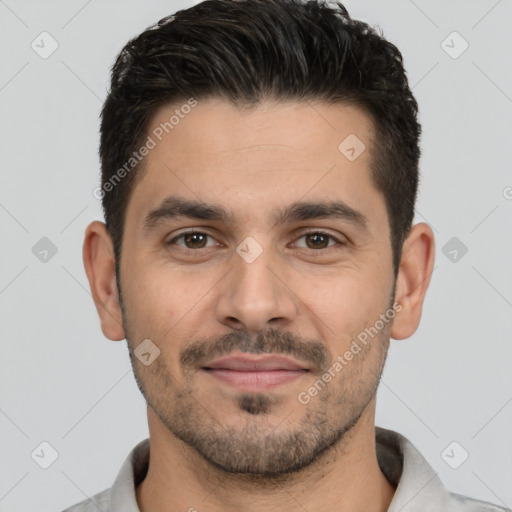 Joyful white young-adult male with short  black hair and brown eyes