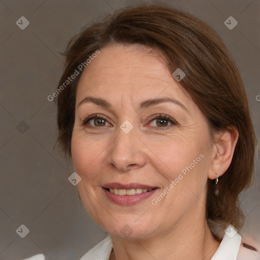 Joyful white adult female with medium  brown hair and brown eyes