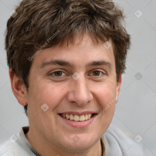 Joyful white adult male with short  brown hair and grey eyes