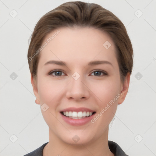 Joyful white young-adult female with short  brown hair and grey eyes