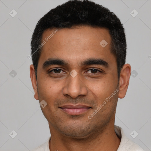 Joyful latino young-adult male with short  black hair and brown eyes