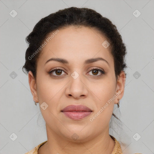 Joyful latino young-adult female with short  brown hair and brown eyes