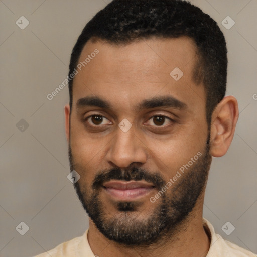 Joyful black young-adult male with short  black hair and brown eyes