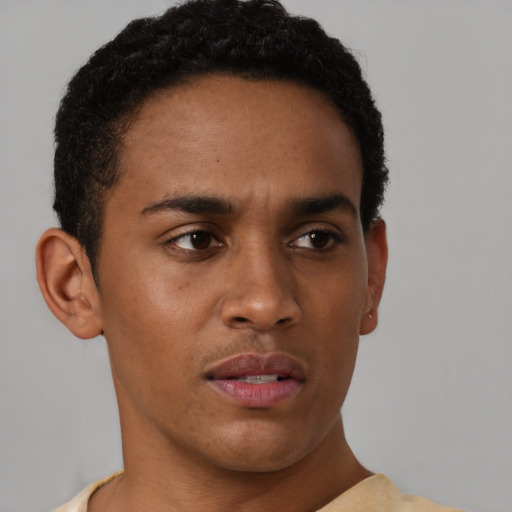 Neutral black young-adult male with short  brown hair and brown eyes