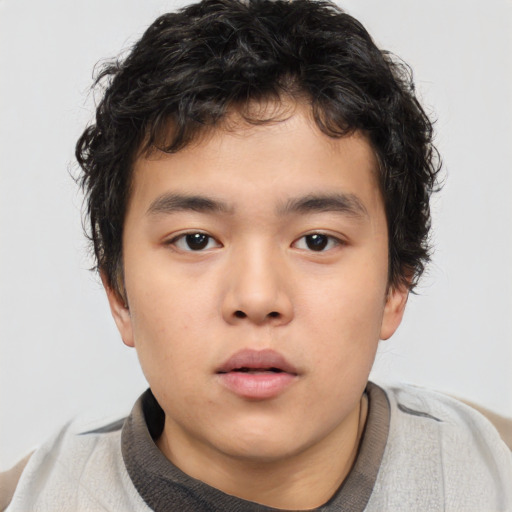 Neutral asian child male with short  brown hair and brown eyes