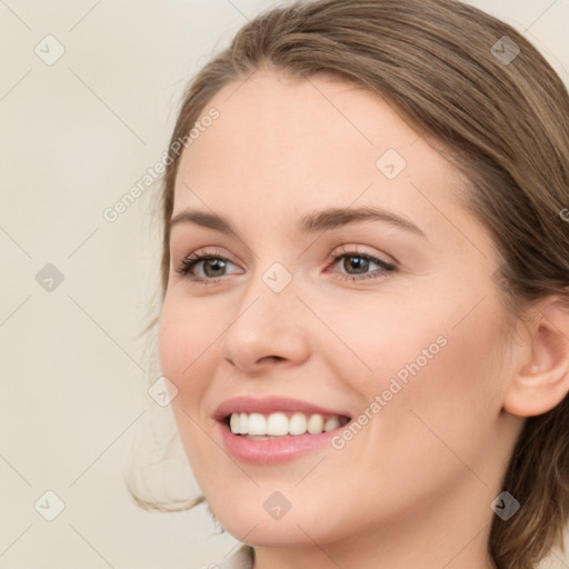 Joyful white young-adult female with medium  brown hair and green eyes