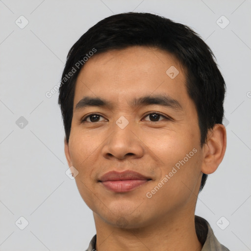 Joyful asian young-adult male with short  black hair and brown eyes