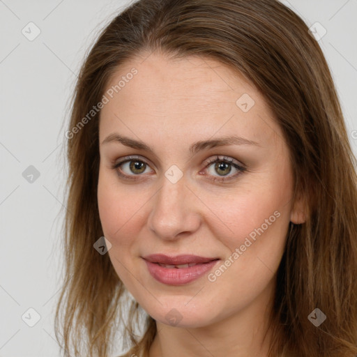 Joyful white young-adult female with long  brown hair and green eyes