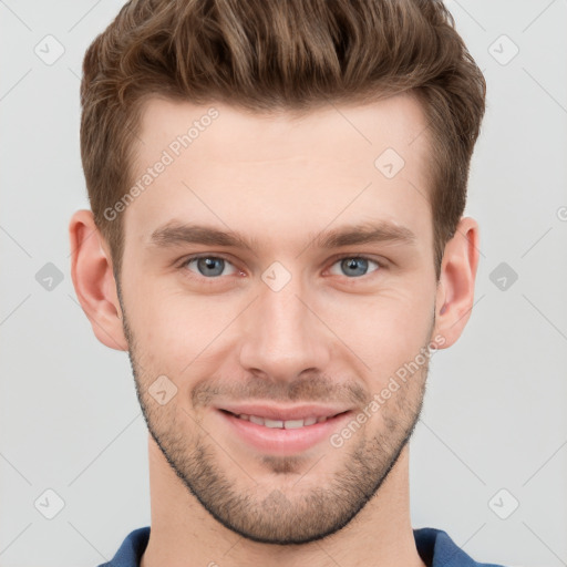 Joyful white young-adult male with short  brown hair and grey eyes