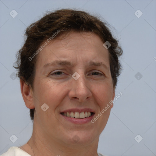 Joyful white adult female with short  brown hair and brown eyes