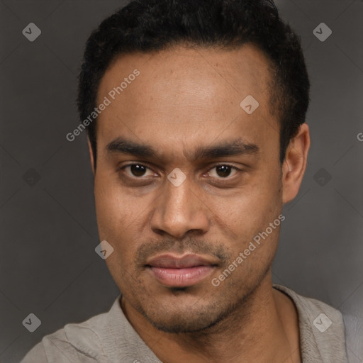 Joyful latino young-adult male with short  black hair and brown eyes