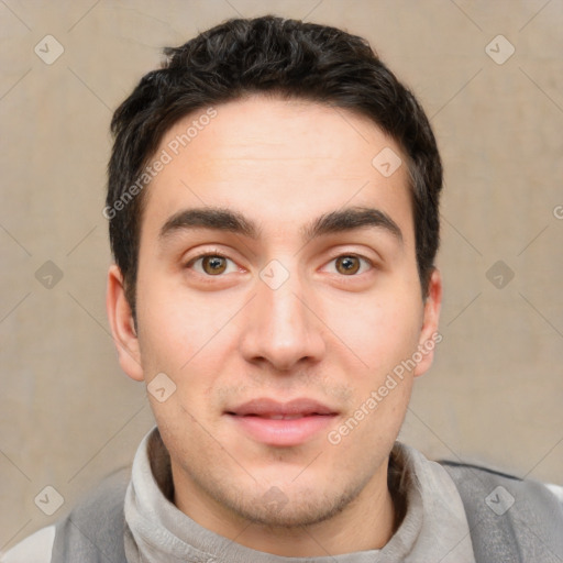 Joyful white young-adult male with short  black hair and brown eyes