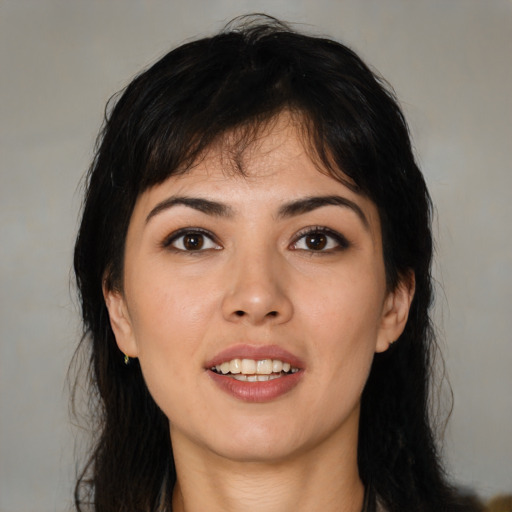 Joyful asian young-adult female with medium  black hair and brown eyes