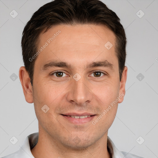 Joyful white young-adult male with short  brown hair and brown eyes