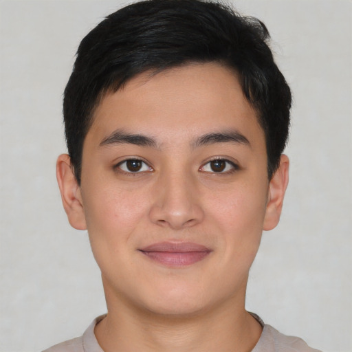 Joyful asian young-adult male with short  brown hair and brown eyes