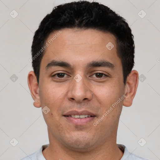 Joyful white young-adult male with short  black hair and brown eyes