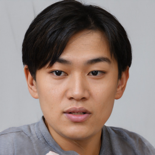 Neutral asian young-adult male with short  black hair and brown eyes
