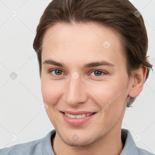 Joyful white young-adult female with short  brown hair and brown eyes