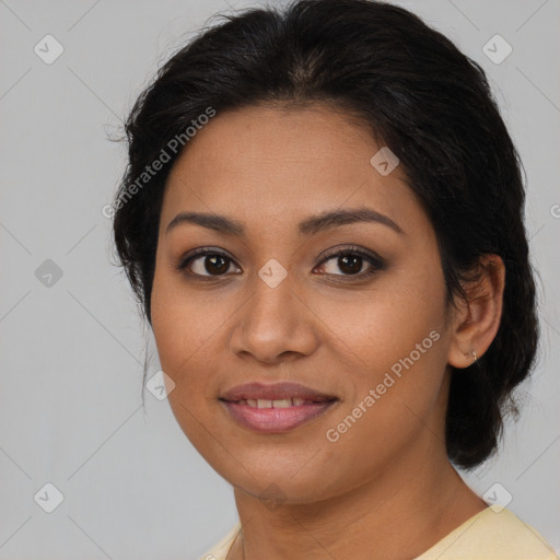 Joyful latino young-adult female with medium  brown hair and brown eyes