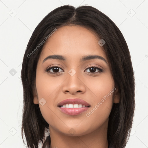 Joyful latino young-adult female with long  black hair and brown eyes