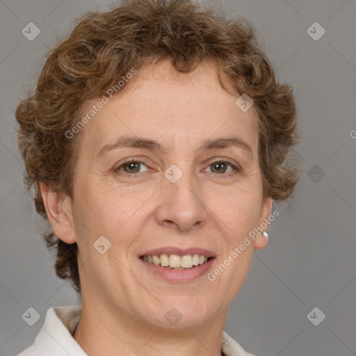 Joyful white adult female with short  brown hair and brown eyes