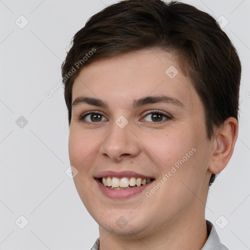 Joyful white young-adult female with short  brown hair and brown eyes