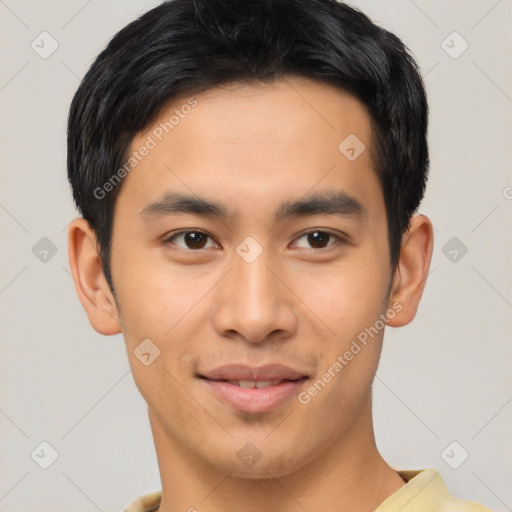 Joyful asian young-adult male with short  black hair and brown eyes