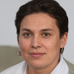 Joyful white adult female with short  brown hair and brown eyes