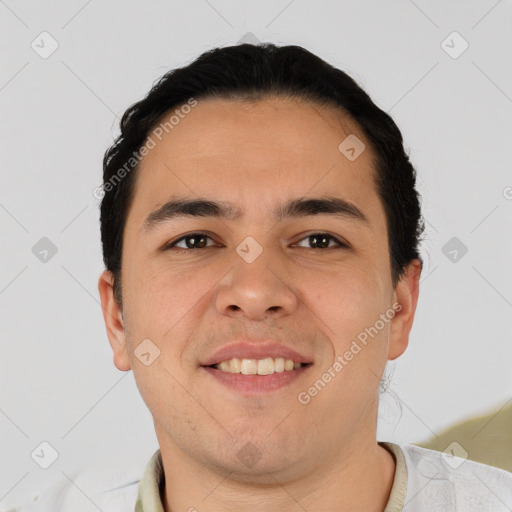 Joyful asian young-adult male with short  brown hair and brown eyes