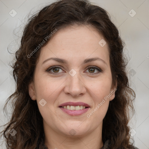 Joyful white adult female with long  brown hair and brown eyes