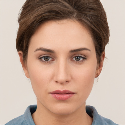 Neutral white young-adult female with short  brown hair and brown eyes