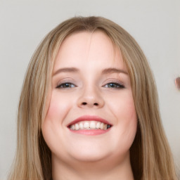 Joyful white young-adult female with long  brown hair and blue eyes