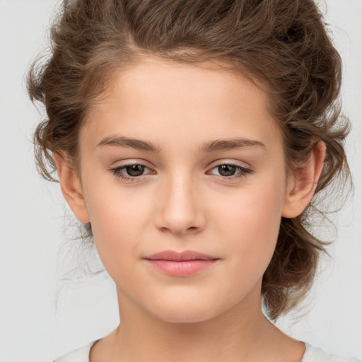 Joyful white child female with medium  brown hair and brown eyes