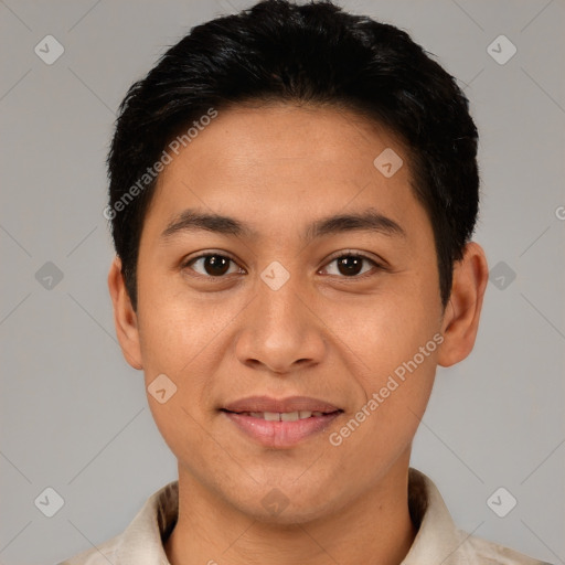 Joyful latino young-adult male with short  brown hair and brown eyes