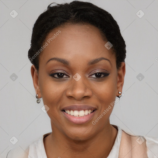 Joyful black young-adult female with short  black hair and brown eyes