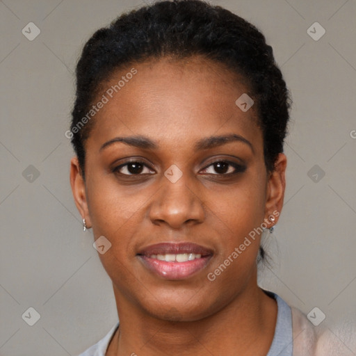 Joyful black young-adult female with short  black hair and brown eyes