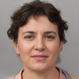 Joyful white adult female with short  brown hair and brown eyes