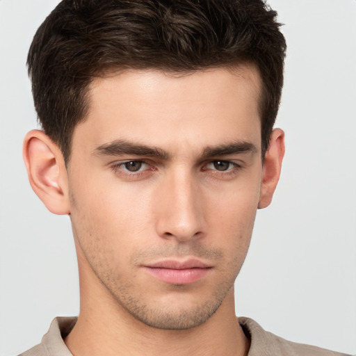 Neutral white young-adult male with short  brown hair and brown eyes