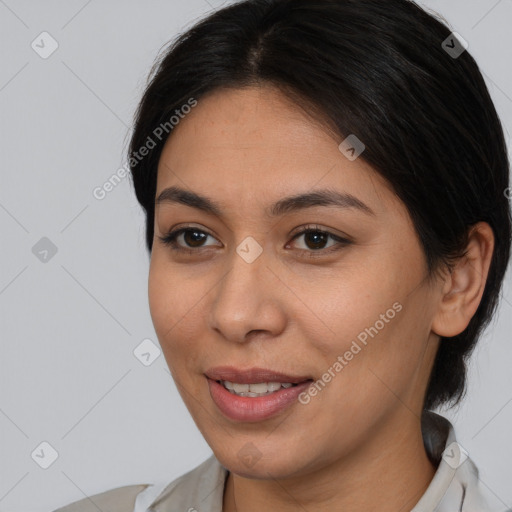 Joyful latino young-adult female with medium  brown hair and brown eyes