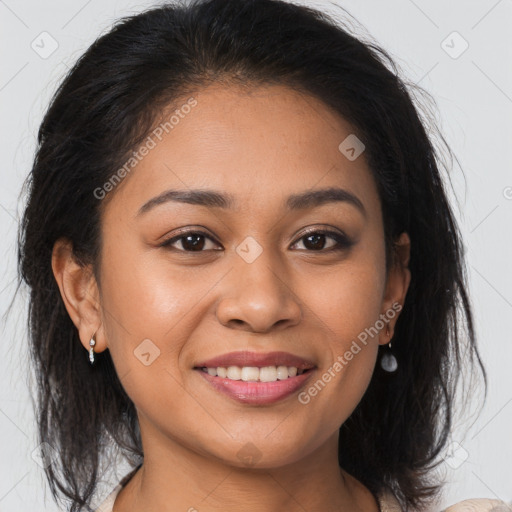 Joyful latino young-adult female with medium  brown hair and brown eyes