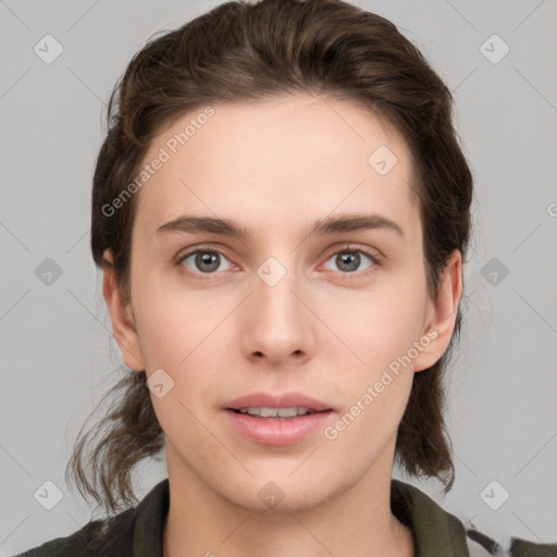 Joyful white young-adult female with medium  brown hair and green eyes