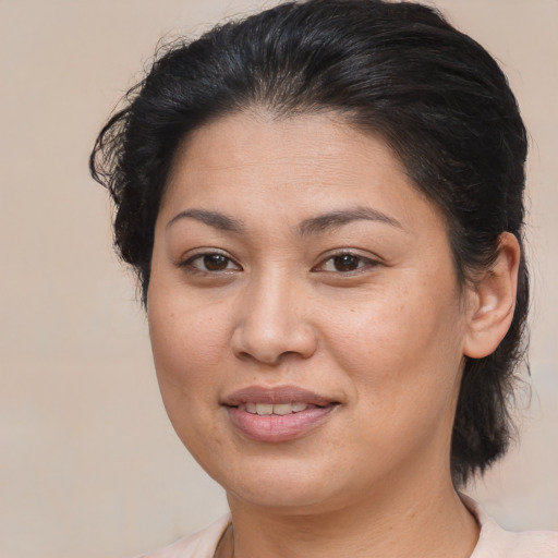Joyful asian young-adult female with medium  brown hair and brown eyes