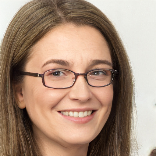 Joyful white adult female with long  brown hair and brown eyes